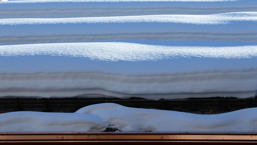 3 rows of No-Flash III 3-Pipe Snow Fences Retaining Heavy Snow - close-up