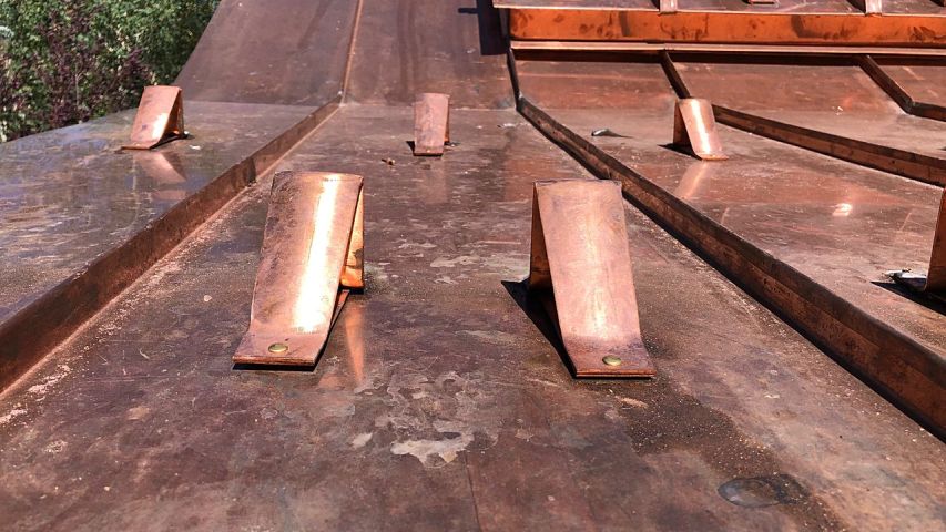 Copper Rocky Guard RG5 soldered to copper metal panel roof