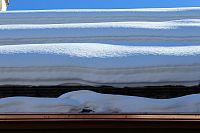 3 rows of No-Flash III 3-Pipe Snow Fences Retaining Heavy Snow - close-up