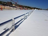 Single Ply 2-Pipe Snow Fence installed on large single-ply membrane roof - downslope